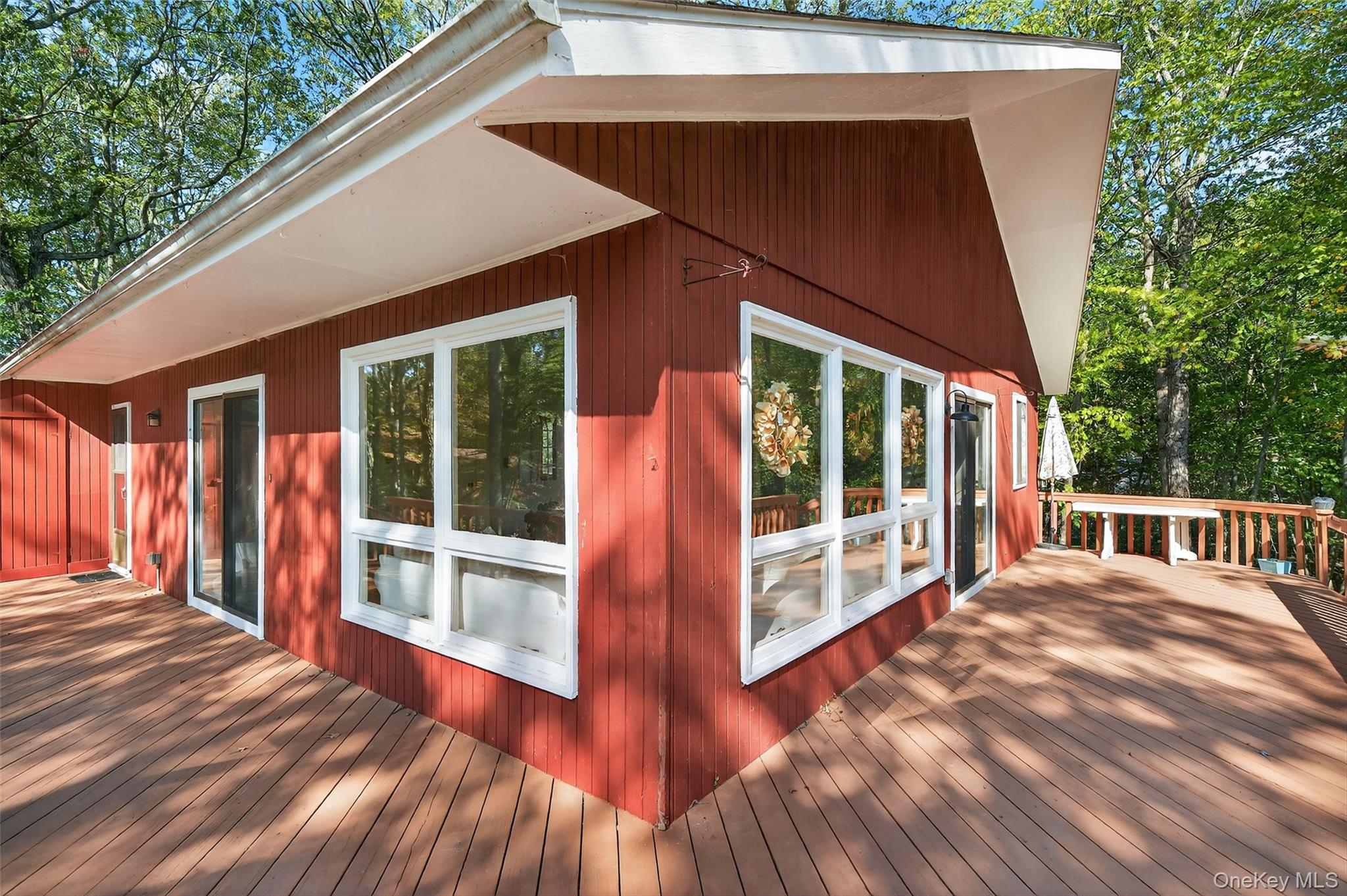 75 Pebble Path Rock Hill, NY 12775 - Photo 25 of 39 a view of balcony with floor to ceiling window and wooden floor