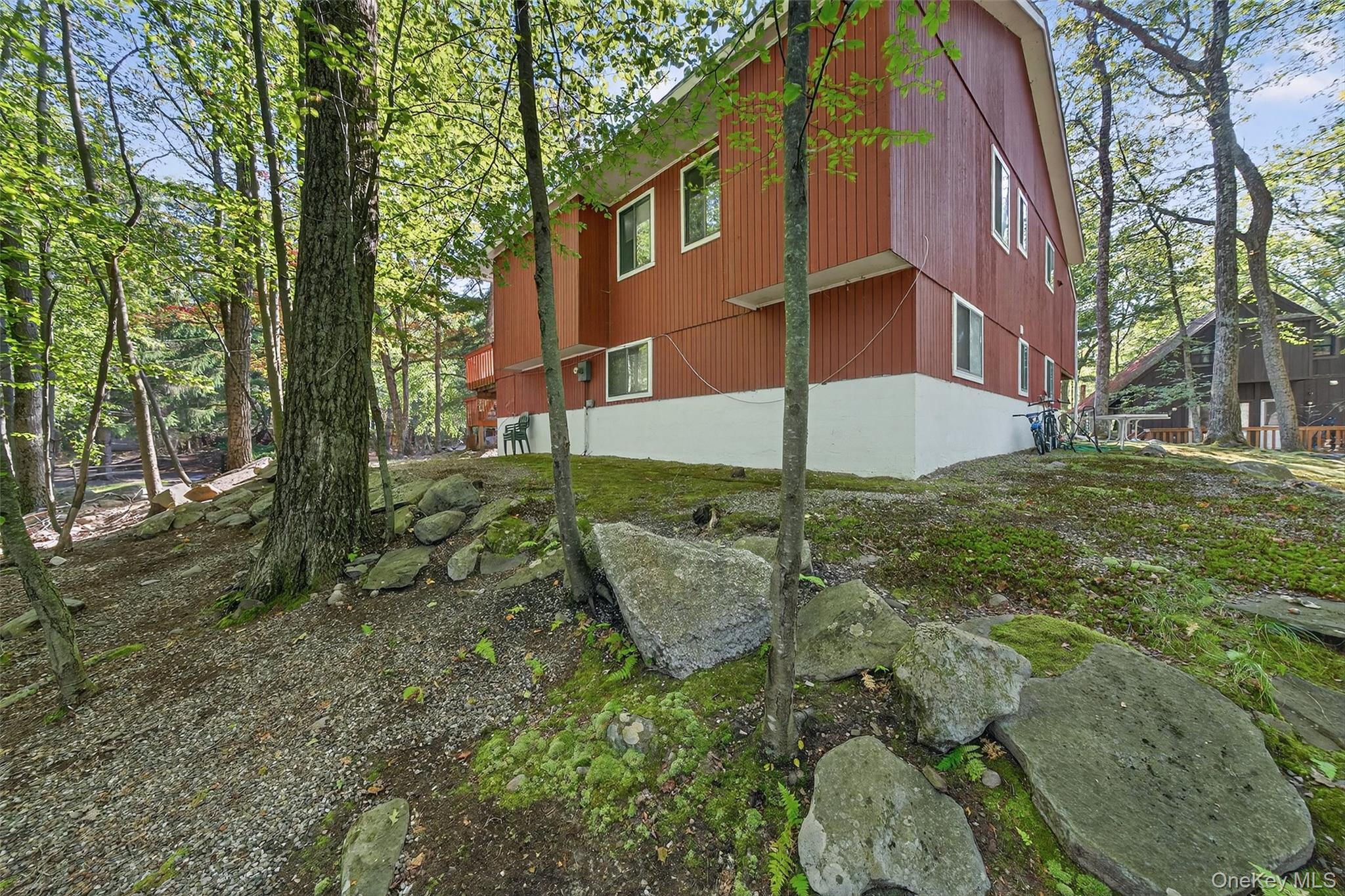 75 Pebble Path Rock Hill, NY 12775 - Photo 33 of 39 a backyard of a house with table and chairs