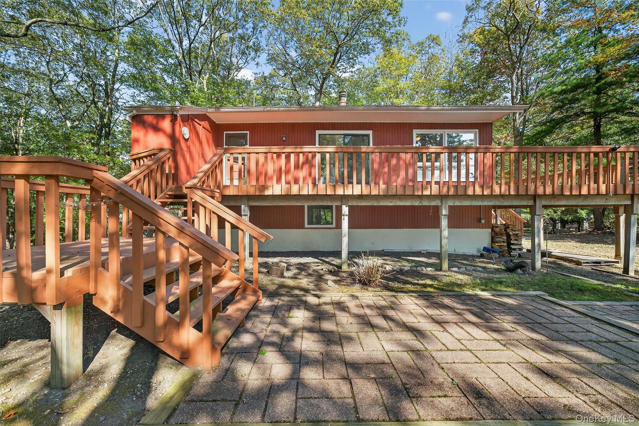 75 Pebble Path Rock Hill, NY 12775 - Photo 5 of 39 a view of a house with backyard and wooden deck