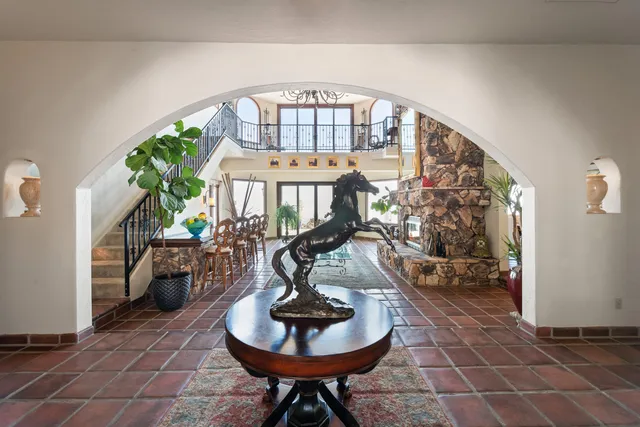 a view of a house with swimming pool and sitting area