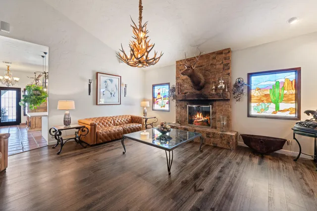 a living room with patio furniture and a potted plants