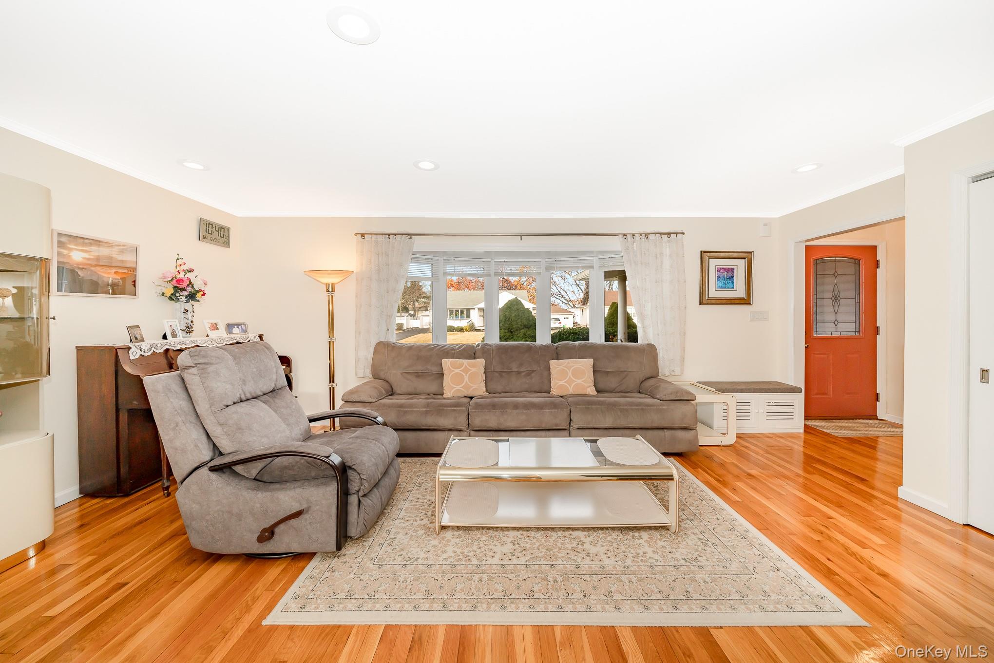 15 Chadwick Road Syosset, NY 11791 - Photo 18 of 35 a living room with furniture and a rug