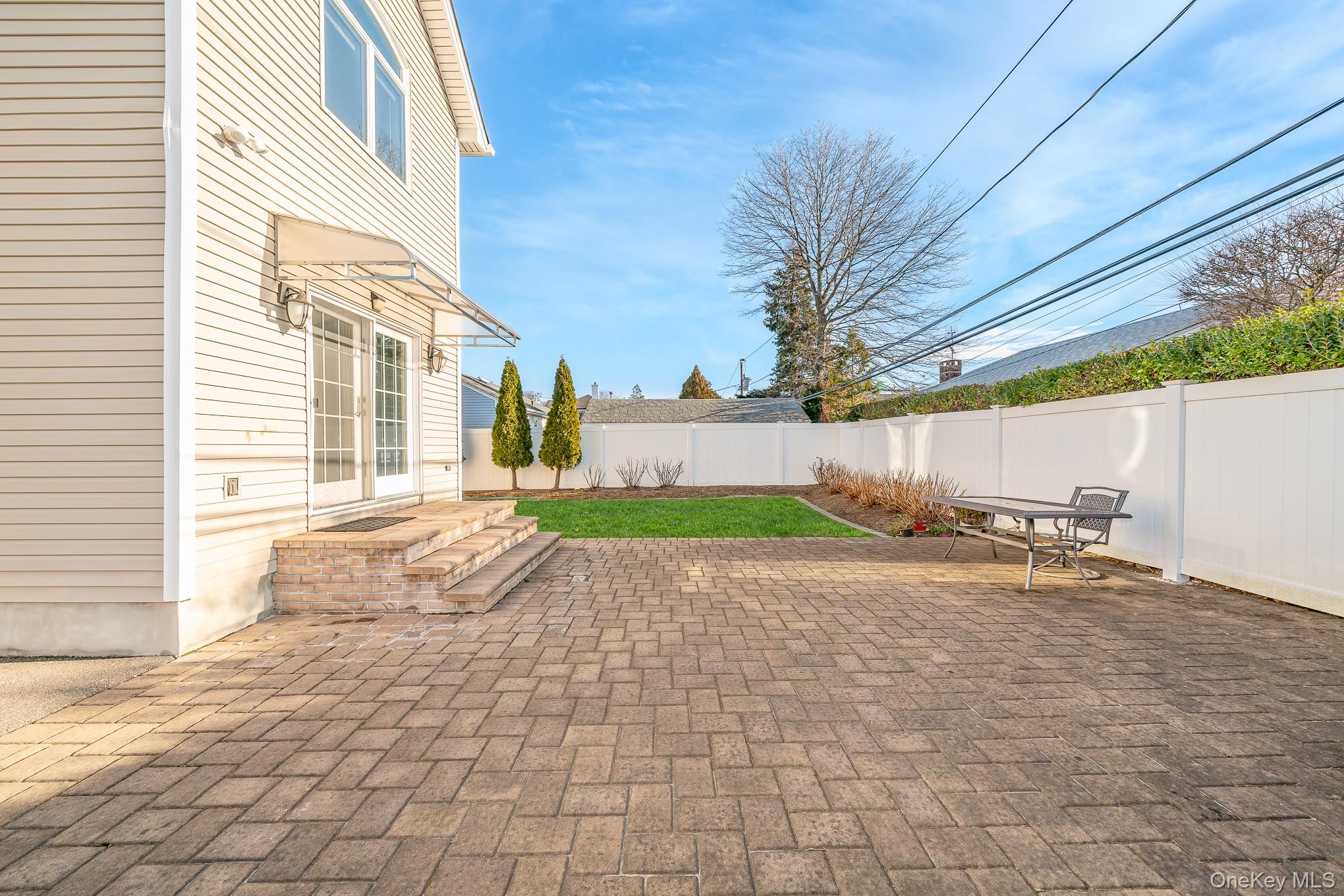 15 Chadwick Road Syosset, NY 11791 - Photo 33 of 35 a view of a house with a yard and garage