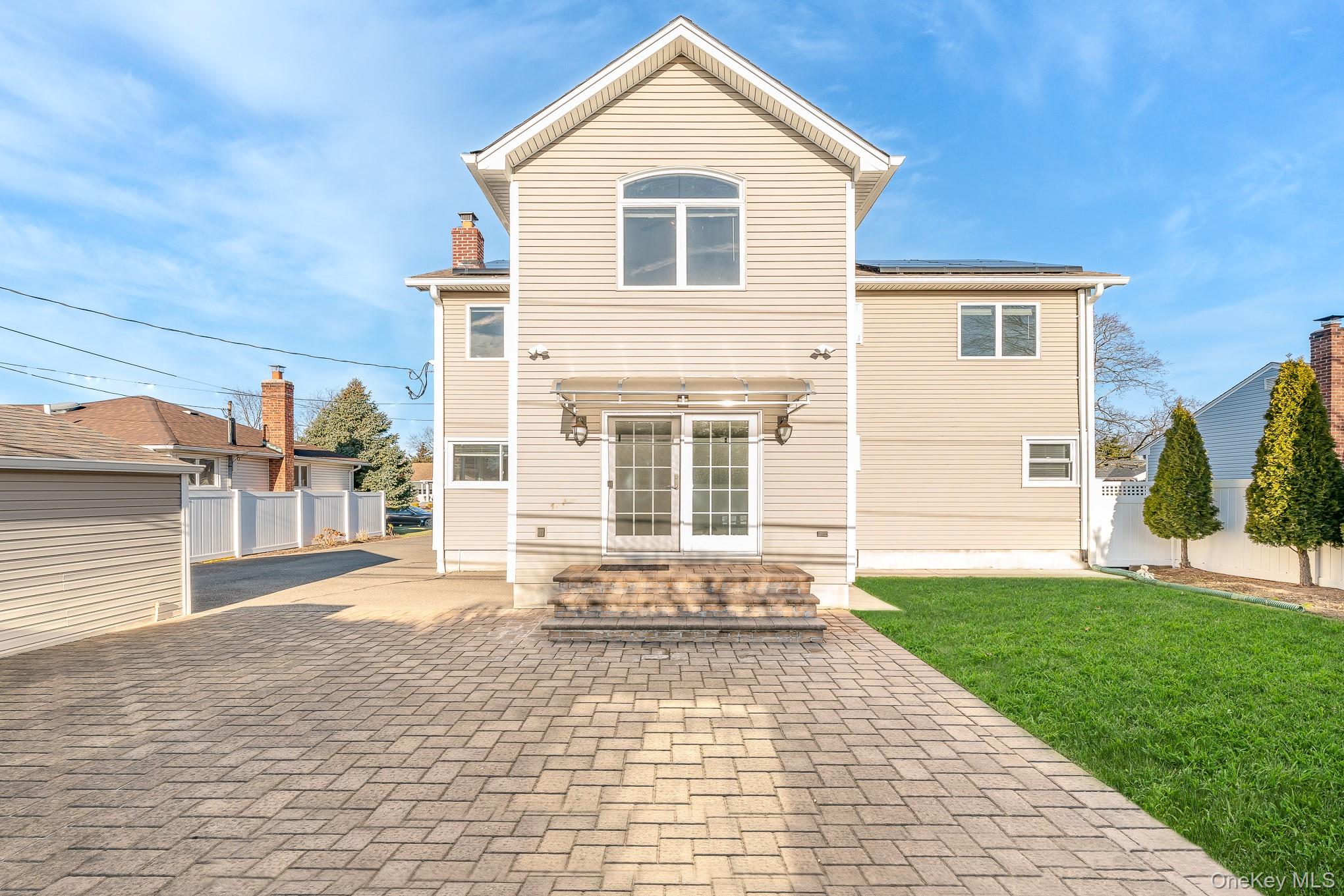 15 Chadwick Road Syosset, NY 11791 - Photo 34 of 35 a front view of a house with a yard