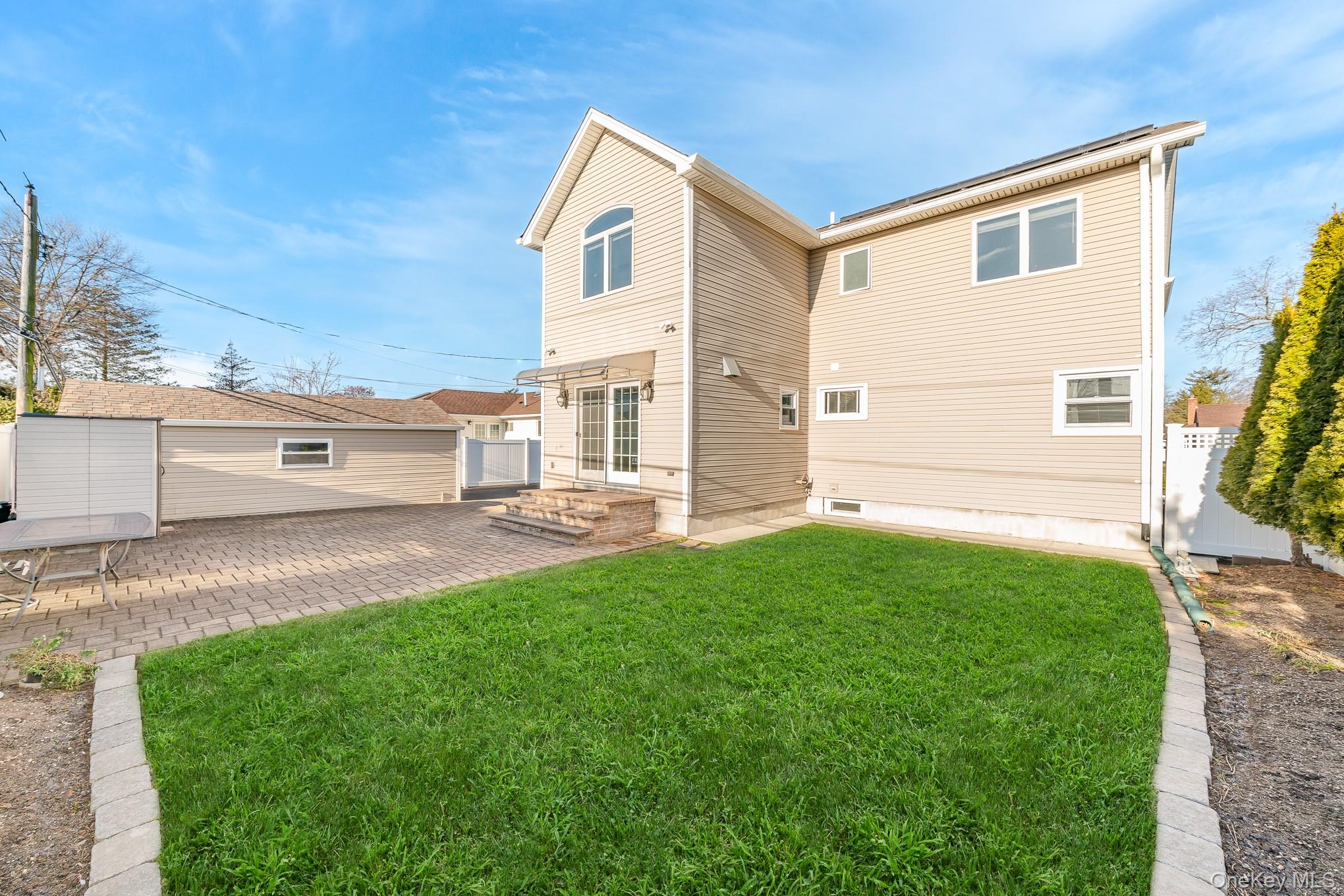15 Chadwick Road Syosset, NY 11791 - Photo 35 of 35 a front view of a house with a yard