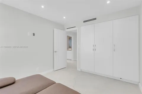 a view of hallway with livingroom and stairs