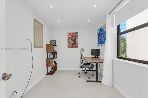 a view of a workspace with furniture