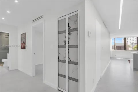 a view of a hallway with closet and entryway