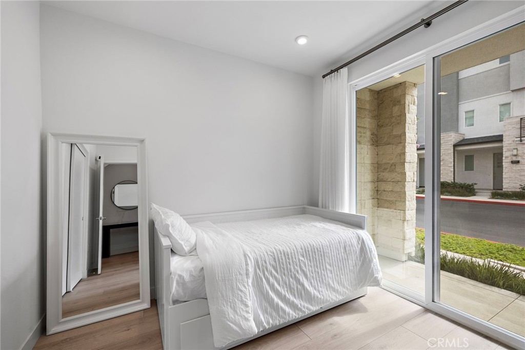 1826 West Bushell Street Anaheim, CA 92805 - Photo 16 of 30 a bedroom with a bed and a large window