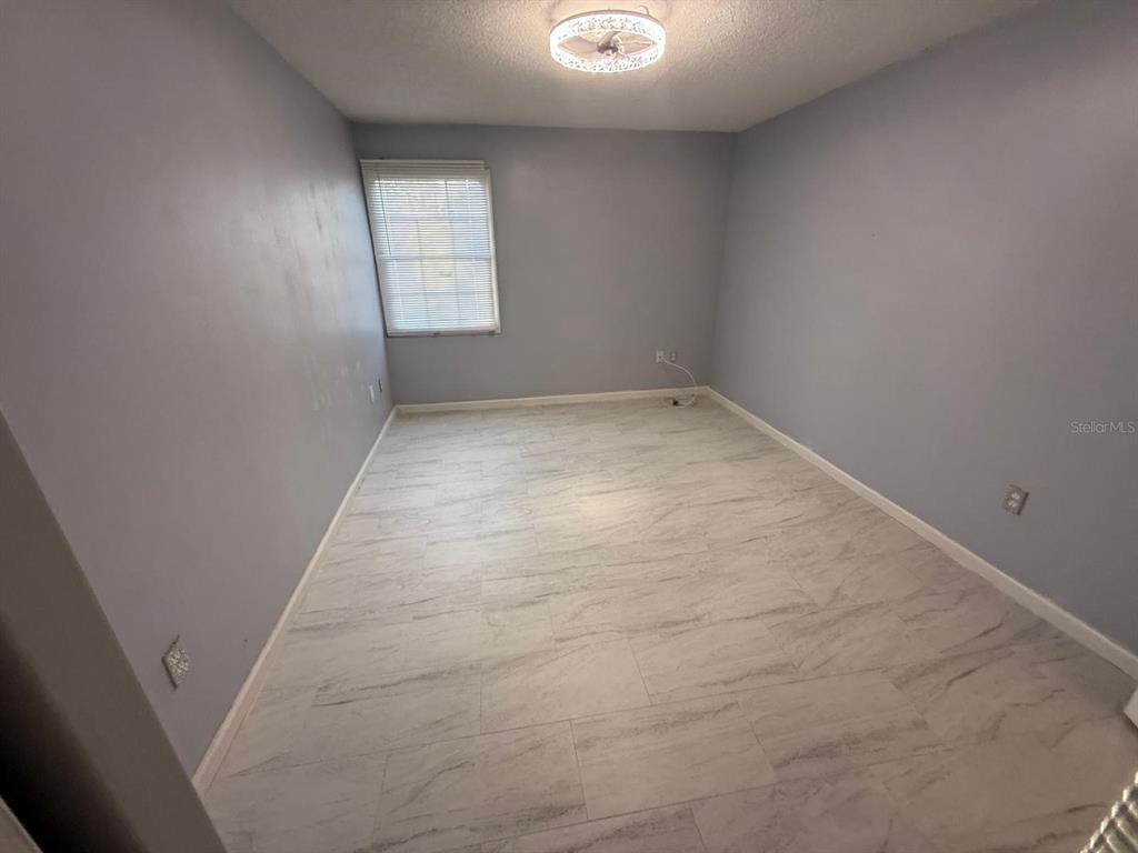 2787 L B McLeod Road, Unit 2787A Orlando, FL 32805 - Photo 12 of 34 an empty room with a window