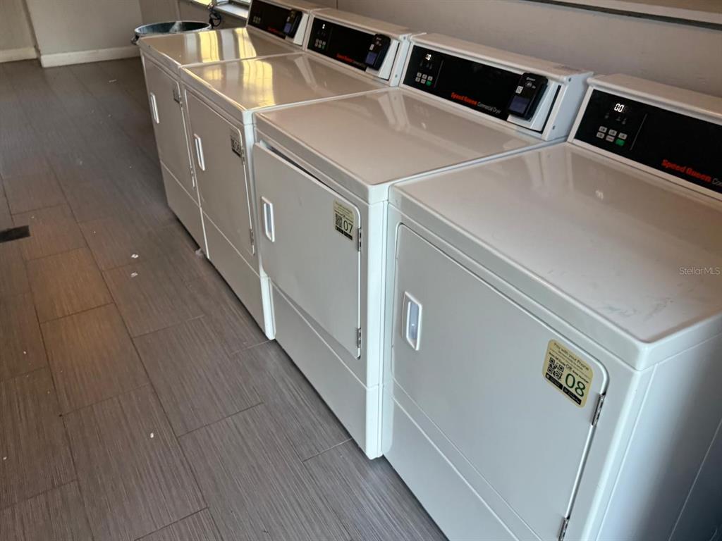 2787 L B McLeod Road, Unit 2787A Orlando, FL 32805 - Photo 13 of 34 a utility room with dryer and washer