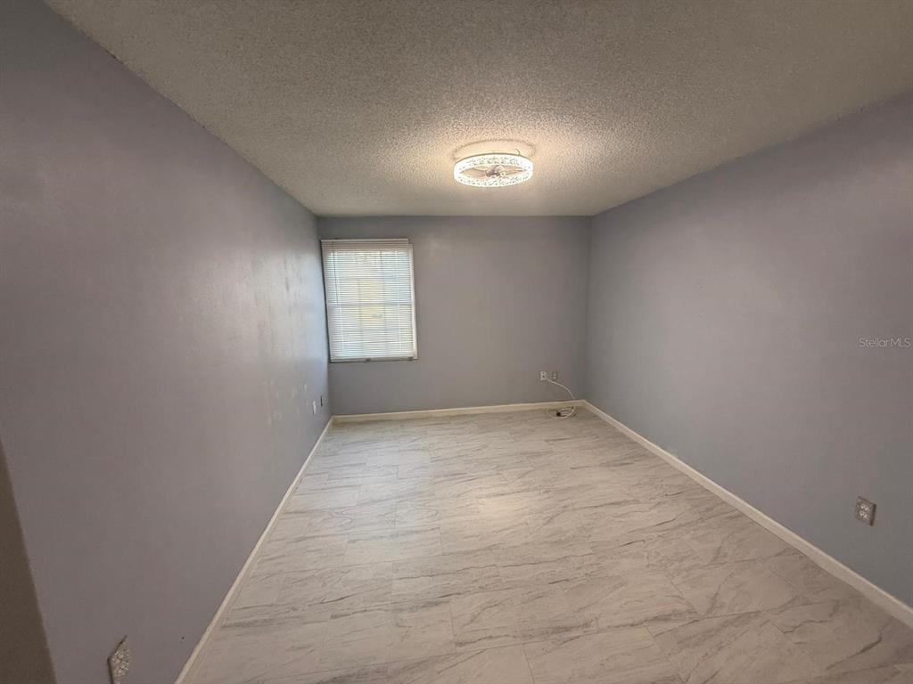 2787 L B McLeod Road, Unit 2787A Orlando, FL 32805 - Photo 24 of 34 an empty room with windows