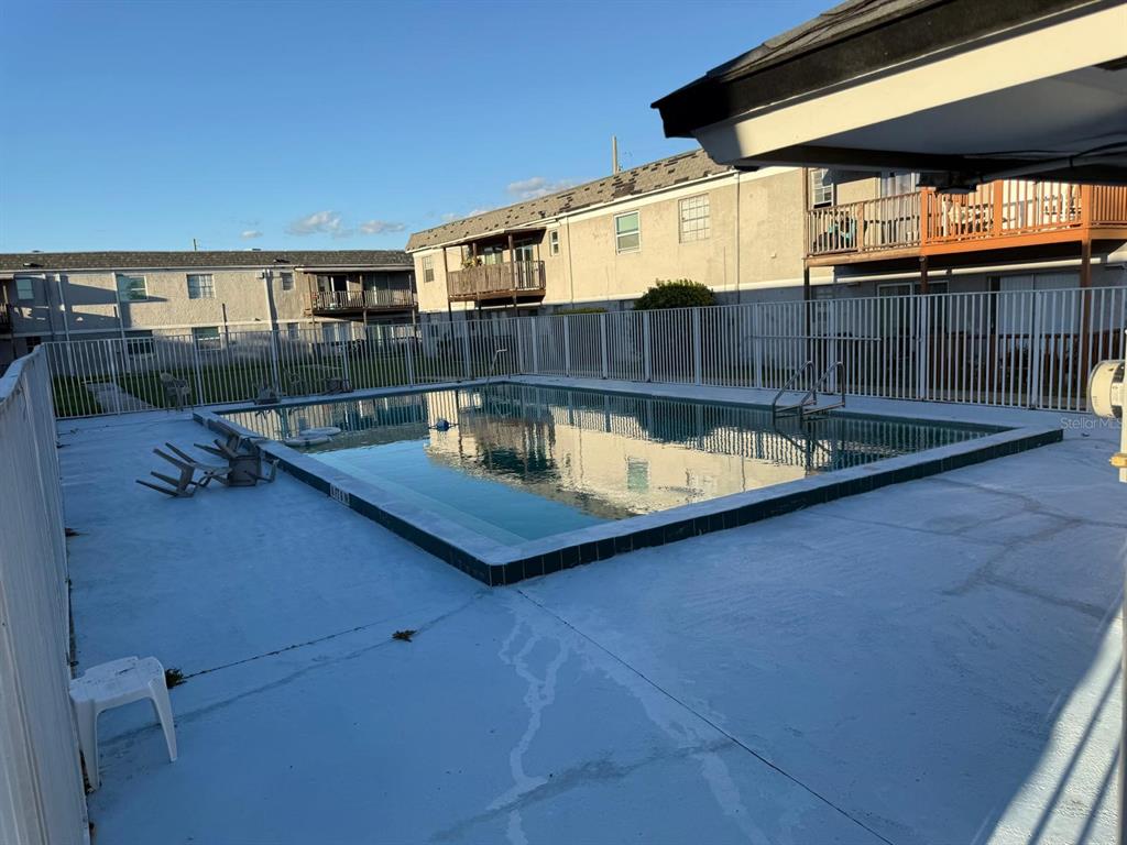 2787 L B McLeod Road, Unit 2787A Orlando, FL 32805 - Photo 30 of 34 a view of a swimming pool with a patio
