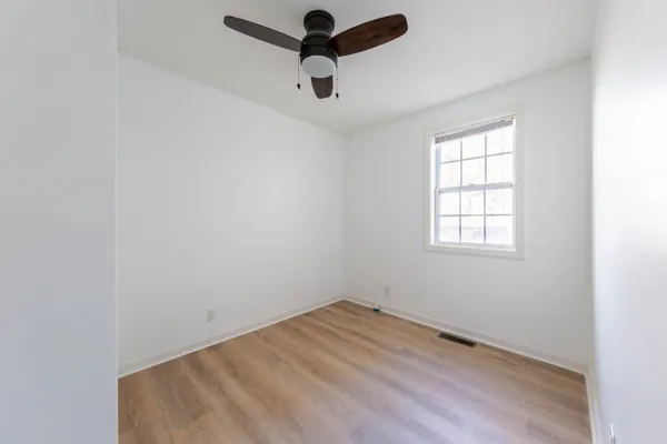 a view of a bathroom from a hallway