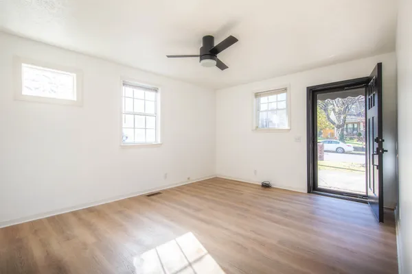 a kitchen with granite countertop a stove top oven and cabinets