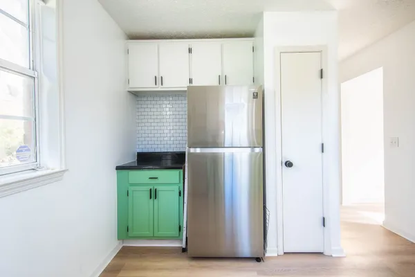 a kitchen with granite countertop a stove and a sink