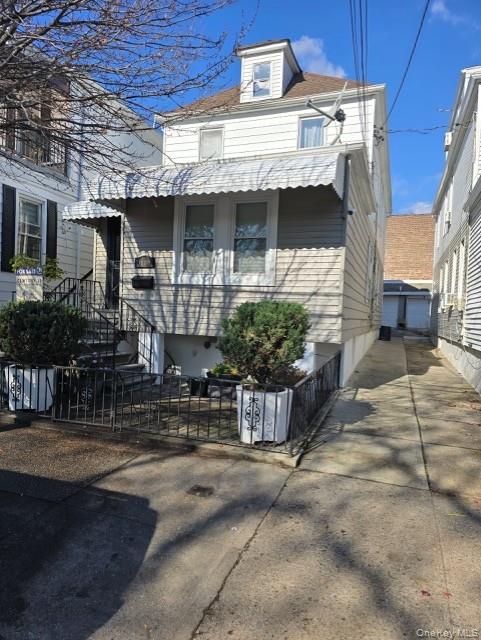 a view of a brick house with plants