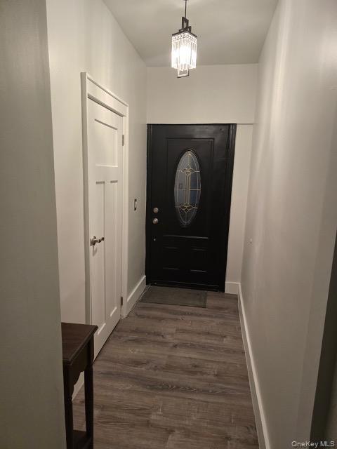 1003 Sacket Avenue Bronx, NY 10462 - Photo 12 of 28 a view of a hallway with wooden floor and staircase