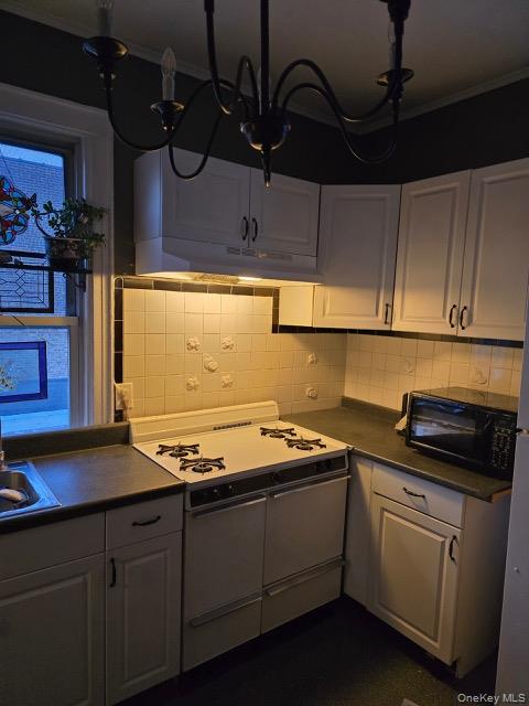 1003 Sacket Avenue Bronx, NY 10462 - Photo 15 of 28 a kitchen with sink cabinets and window