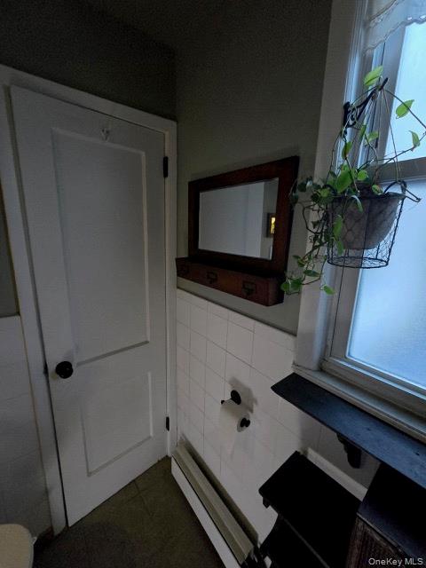 1003 Sacket Avenue Bronx, NY 10462 - Photo 17 of 28 a room with wooden floor and potted plant