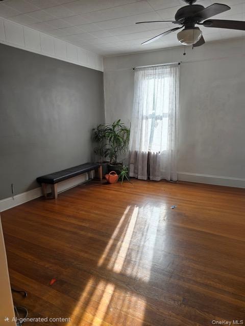 1003 Sacket Avenue Bronx, NY 10462 - Photo 18 of 28 a room with wooden floor and windows