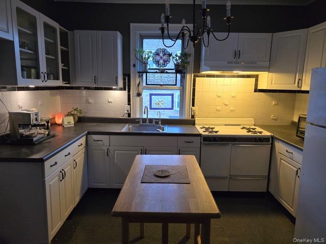 1003 Sacket Avenue Bronx, NY 10462 - Photo 22 of 28 a kitchen with stainless steel appliances a sink stove and cabinets