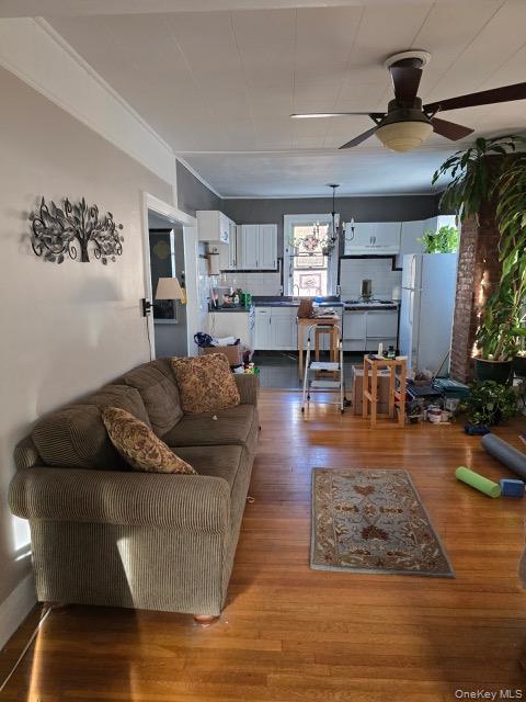1003 Sacket Avenue Bronx, NY 10462 - Photo 23 of 28 a living room with furniture and a wooden floor
