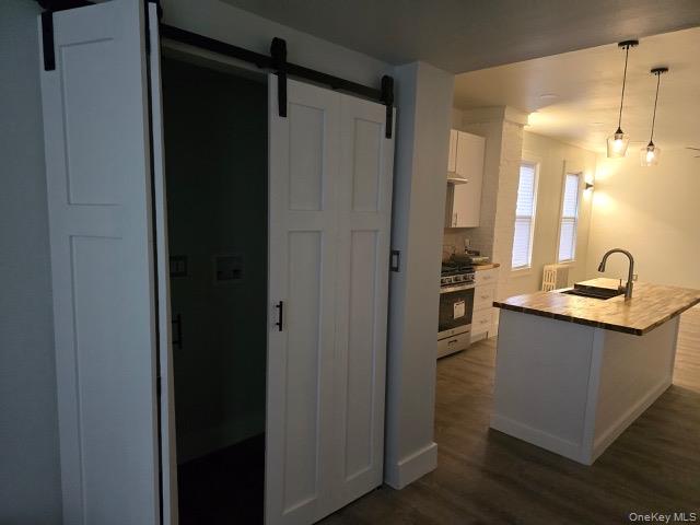 1003 Sacket Avenue Bronx, NY 10462 - Photo 6 of 28 a kitchen with a refrigerator and sink