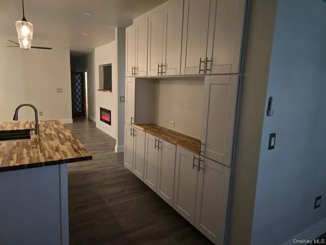 a kitchen with kitchen island a sink stainless steel appliances and cabinets