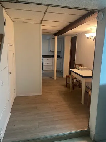 a room with wooden floor and furniture