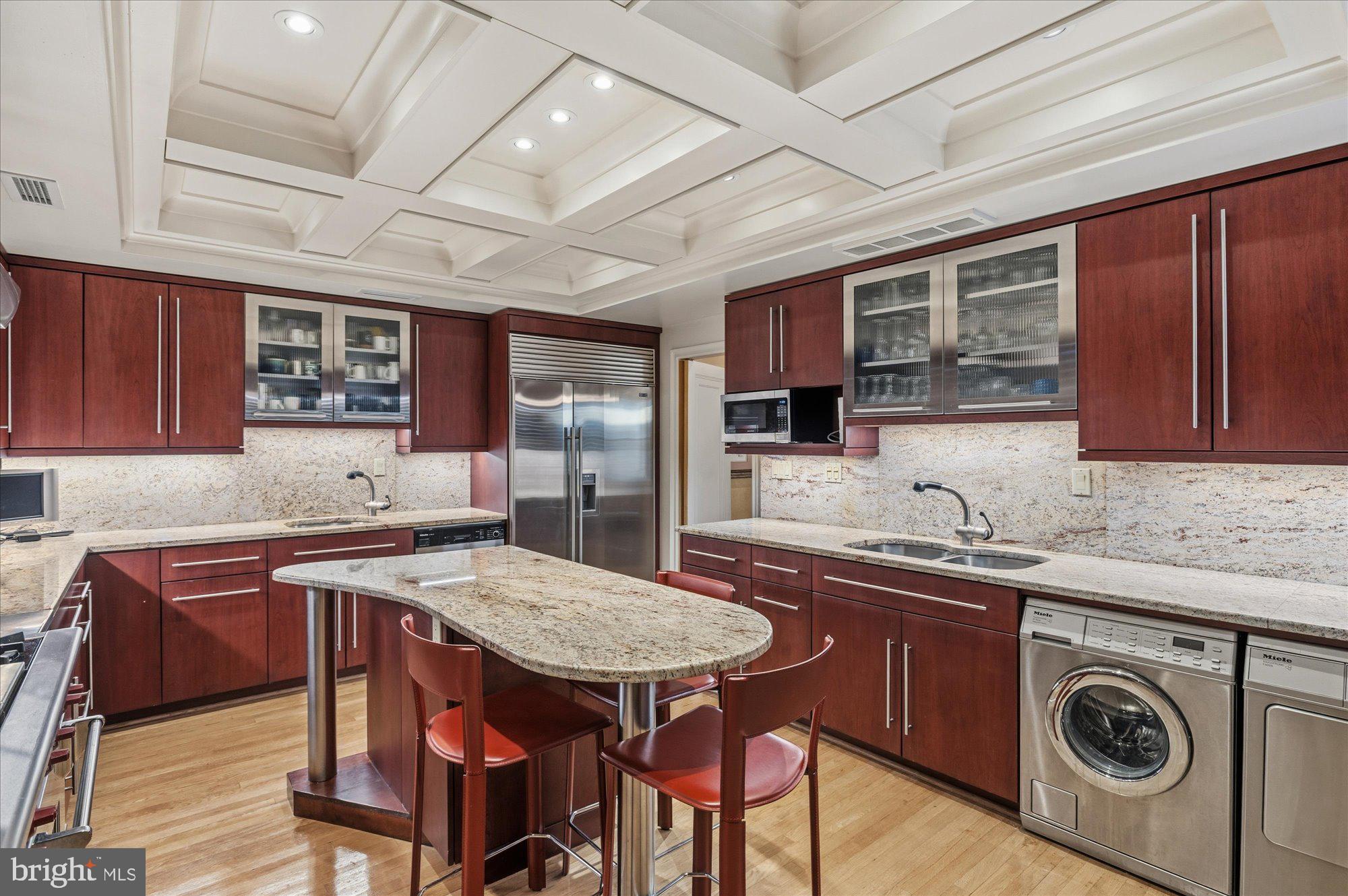 2101 Connecticut Avenue Northwest, Unit 78 Washington, DC 20009 - Photo 18 of 53 a kitchen with stainless steel appliances granite countertop a sink table and chairs