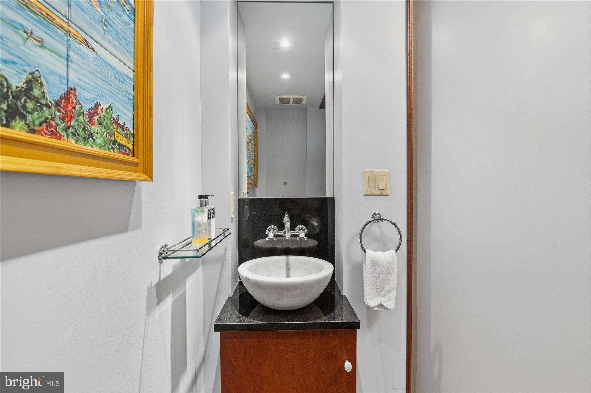 2101 Connecticut Avenue Northwest, Unit 78 Washington, DC 20009 - Photo 19 of 53 a bathroom with a sink and a mirror