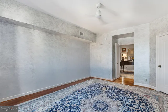 a spacious bathroom with a granite countertop tub sink and mirror