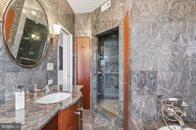 a view of walk in closet with clothes