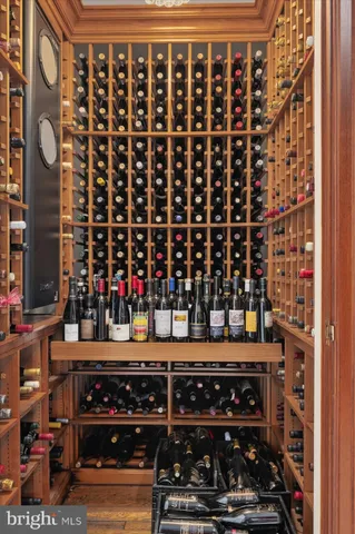a view of a livingroom with wooden floor and a ceiling fan