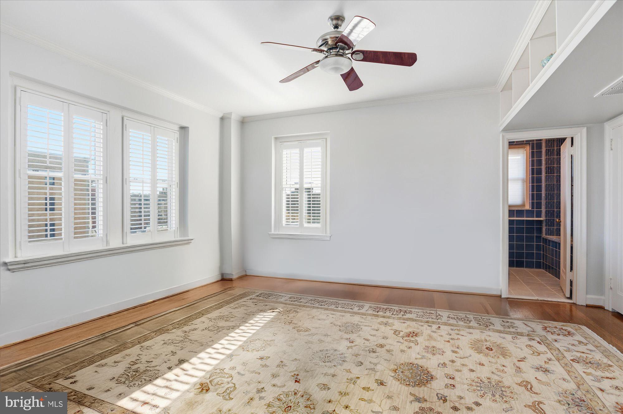 2101 Connecticut Avenue Northwest, Unit 78 Washington, DC 20009 - Photo 29 of 53 a view of a livingroom with wooden floor and a ceiling fan