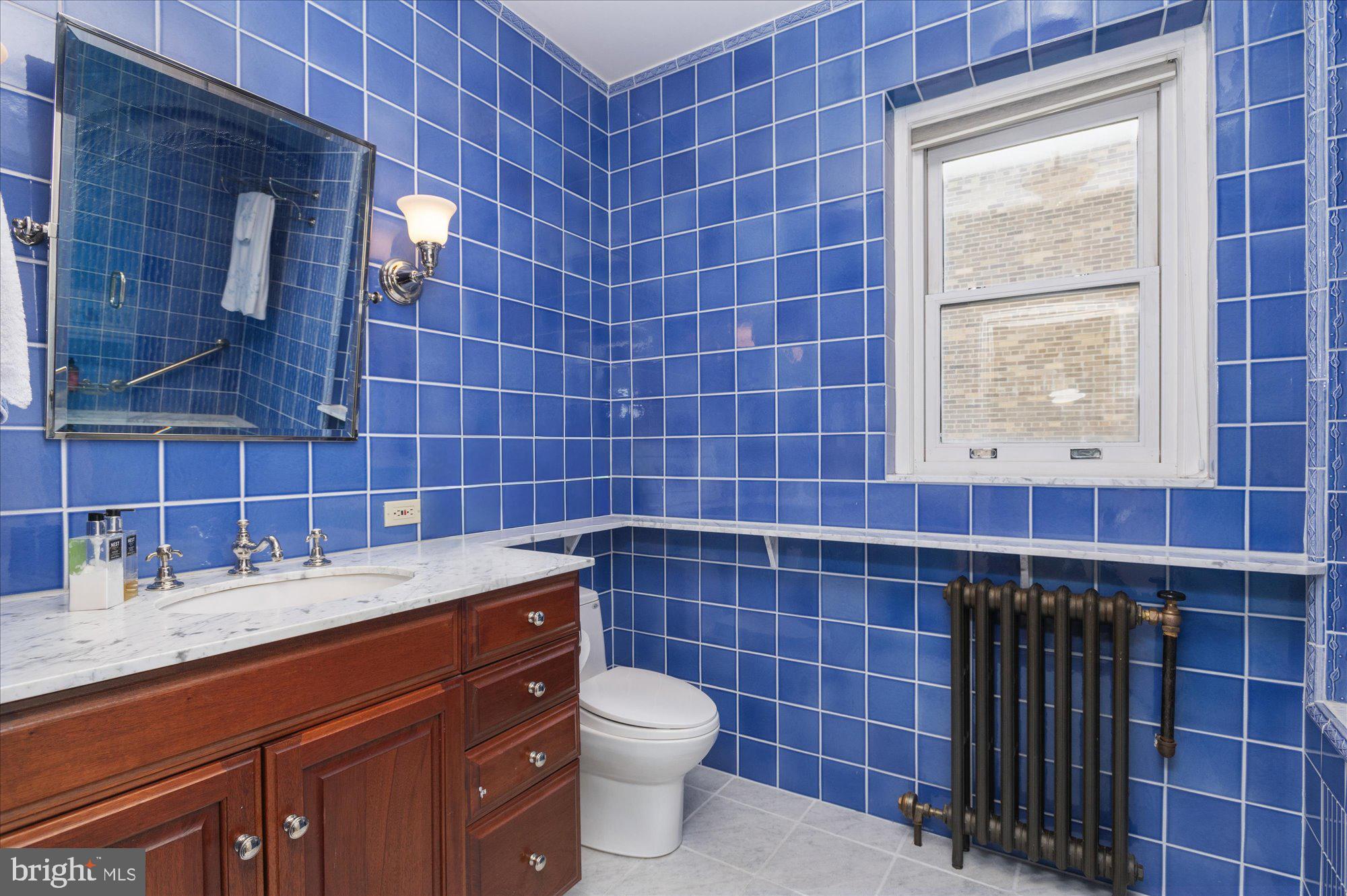 2101 Connecticut Avenue Northwest, Unit 78 Washington, DC 20009 - Photo 33 of 53 a bathroom with a toilet a sink and mirror