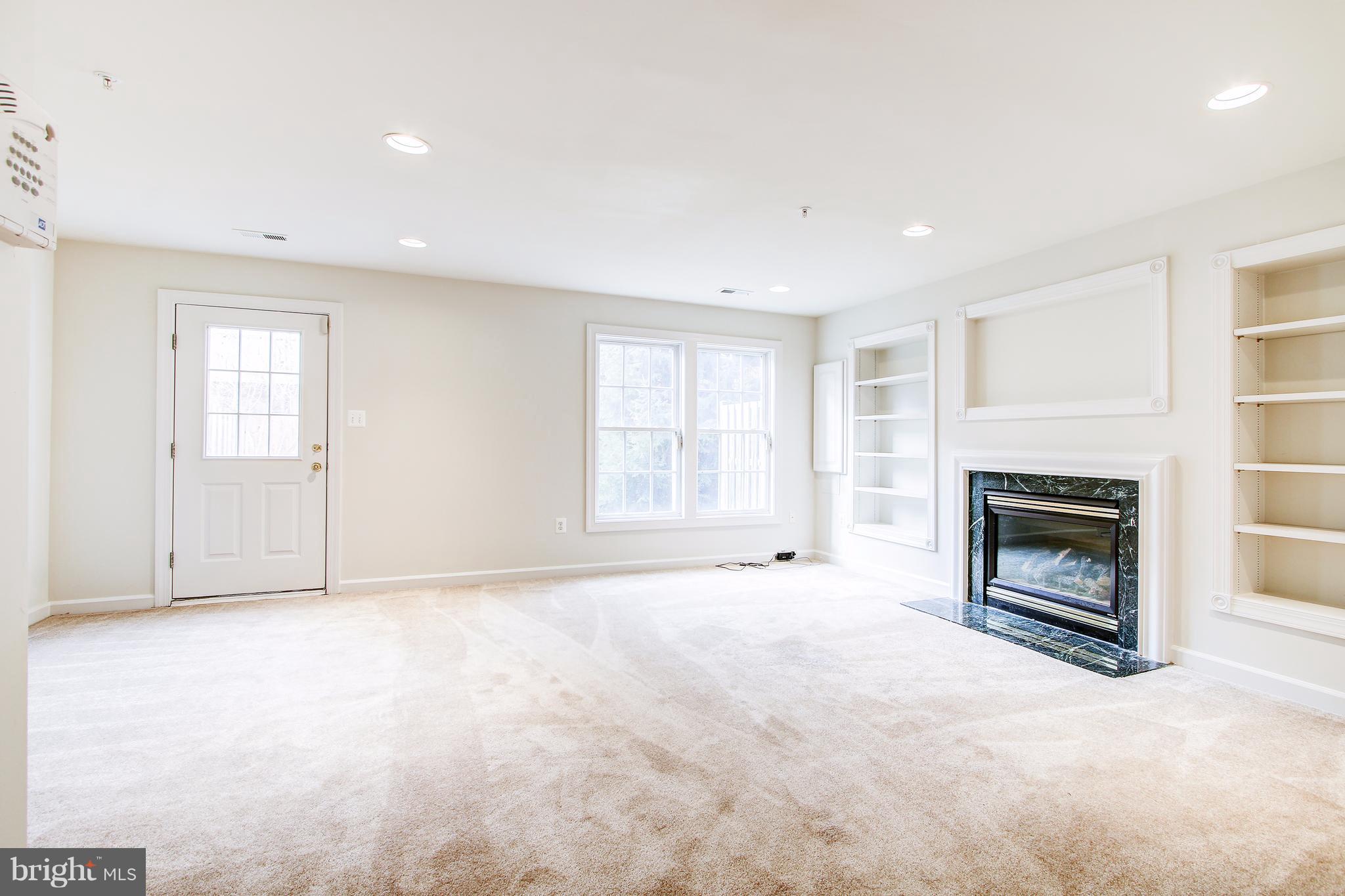 20 Rockingham Court Germantown, MD 20874 - Photo 27 of 30 Lower level family with gas fireplace