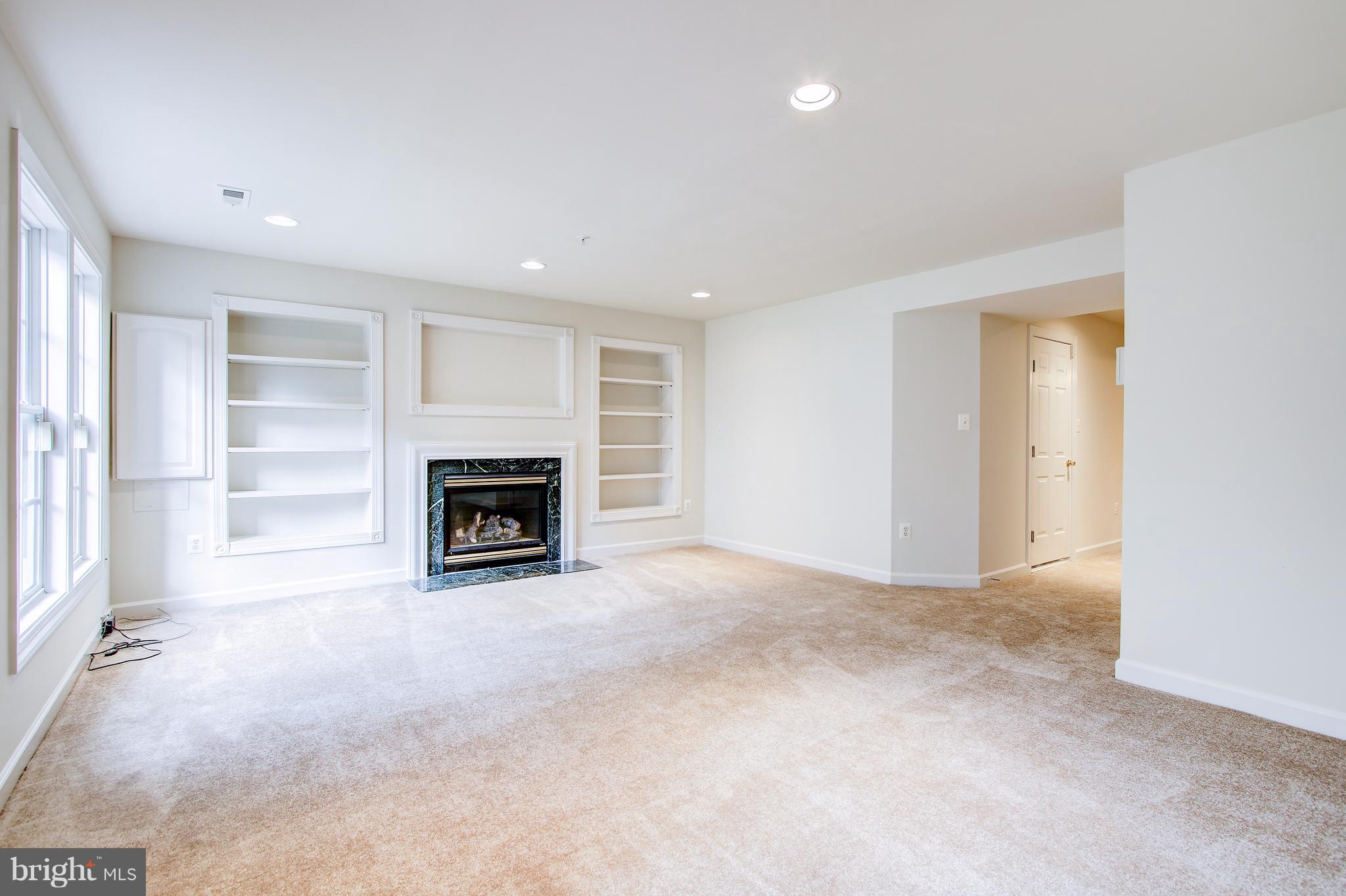 20 Rockingham Court Germantown, MD 20874 - Photo 28 of 30 Built in shelving in lower level family room