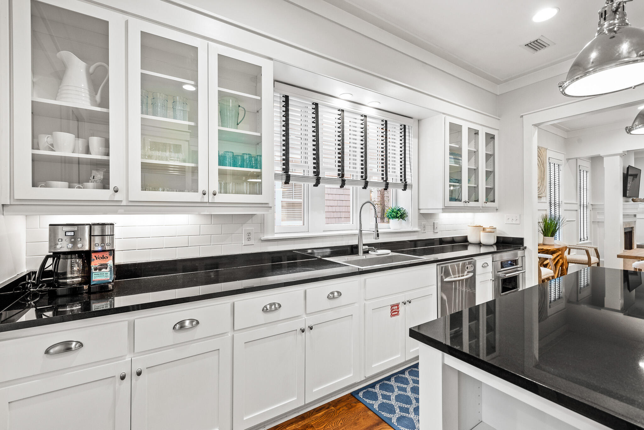 30 North Shingle Lane Watersound, FL 32461 - Photo 20 of 45 a kitchen with stainless steel appliances granite countertop a sink a stove and cabinets