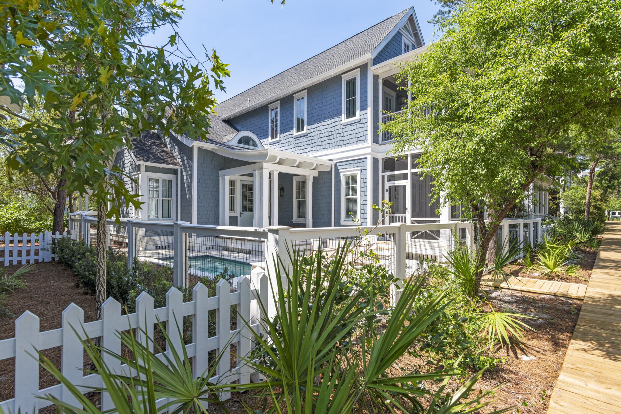 30 North Shingle Lane Watersound, FL 32461 - Photo 2 of 45 a front view of a house with a garden
