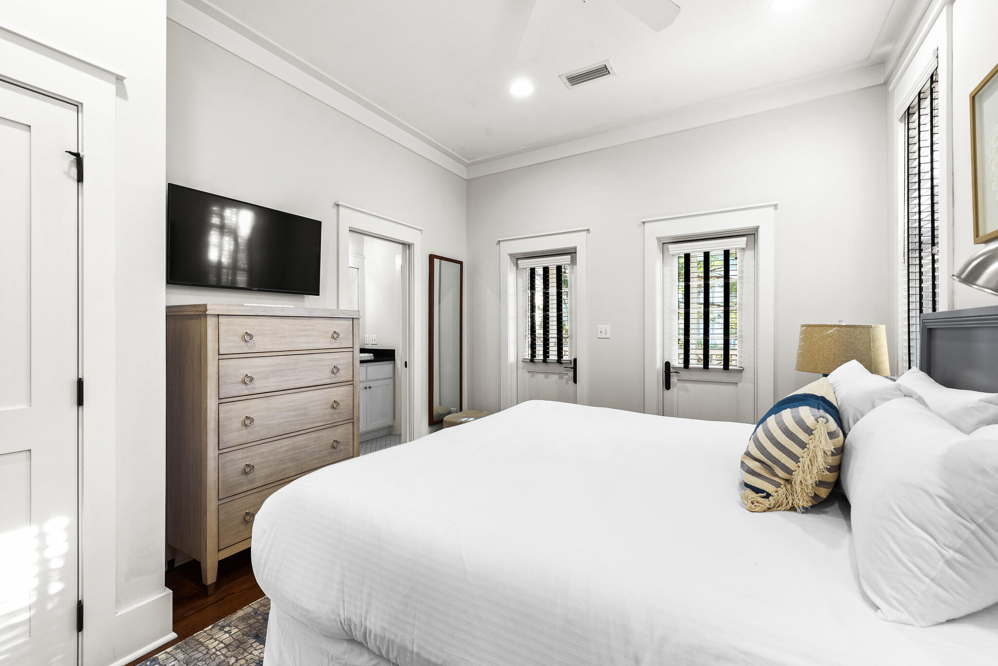 30 North Shingle Lane Watersound, FL 32461 - Photo 31 of 45 a bedroom with a bed and a flat screen tv