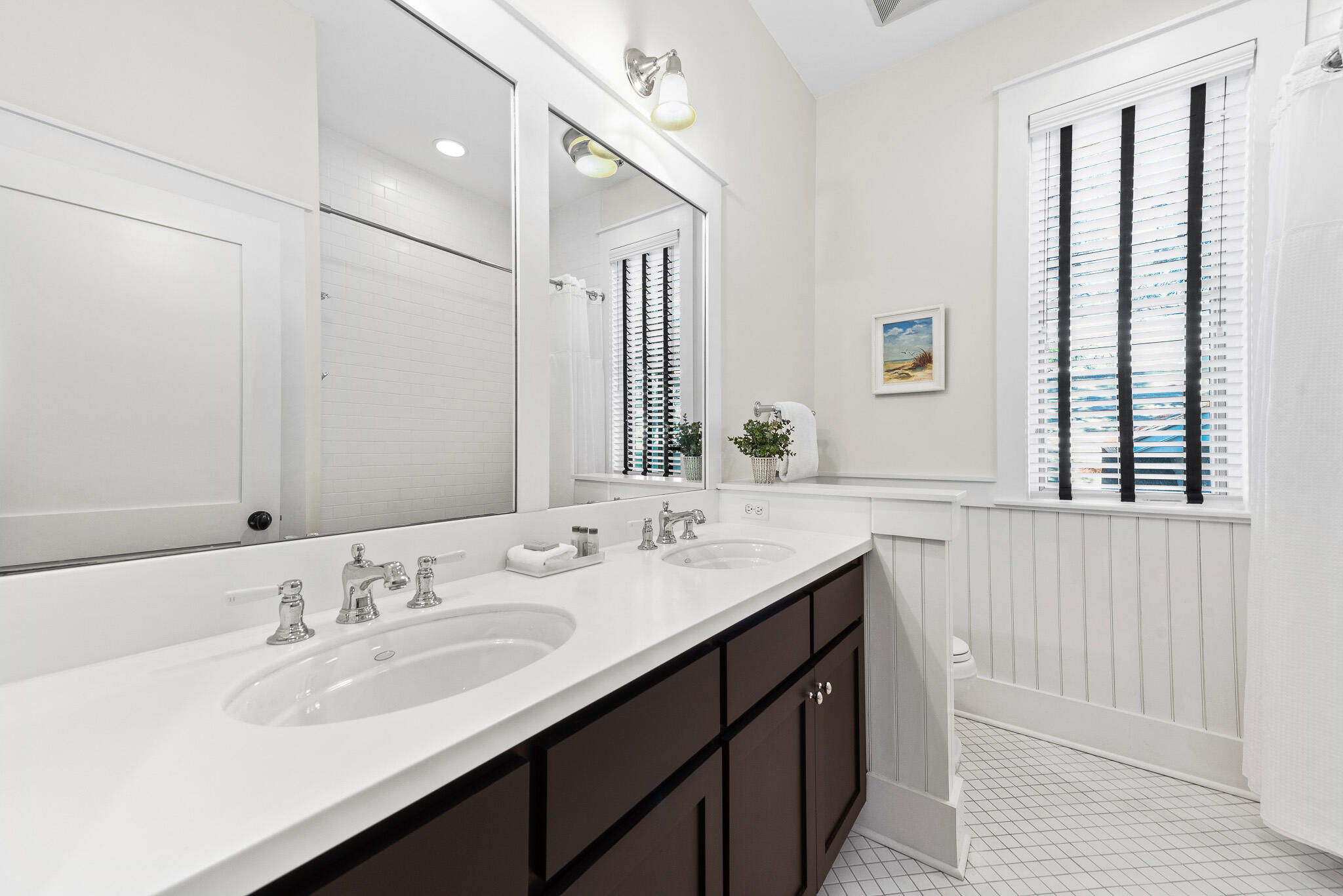30 North Shingle Lane Watersound, FL 32461 - Photo 33 of 45 a bathroom with a double vanity sink and a mirror