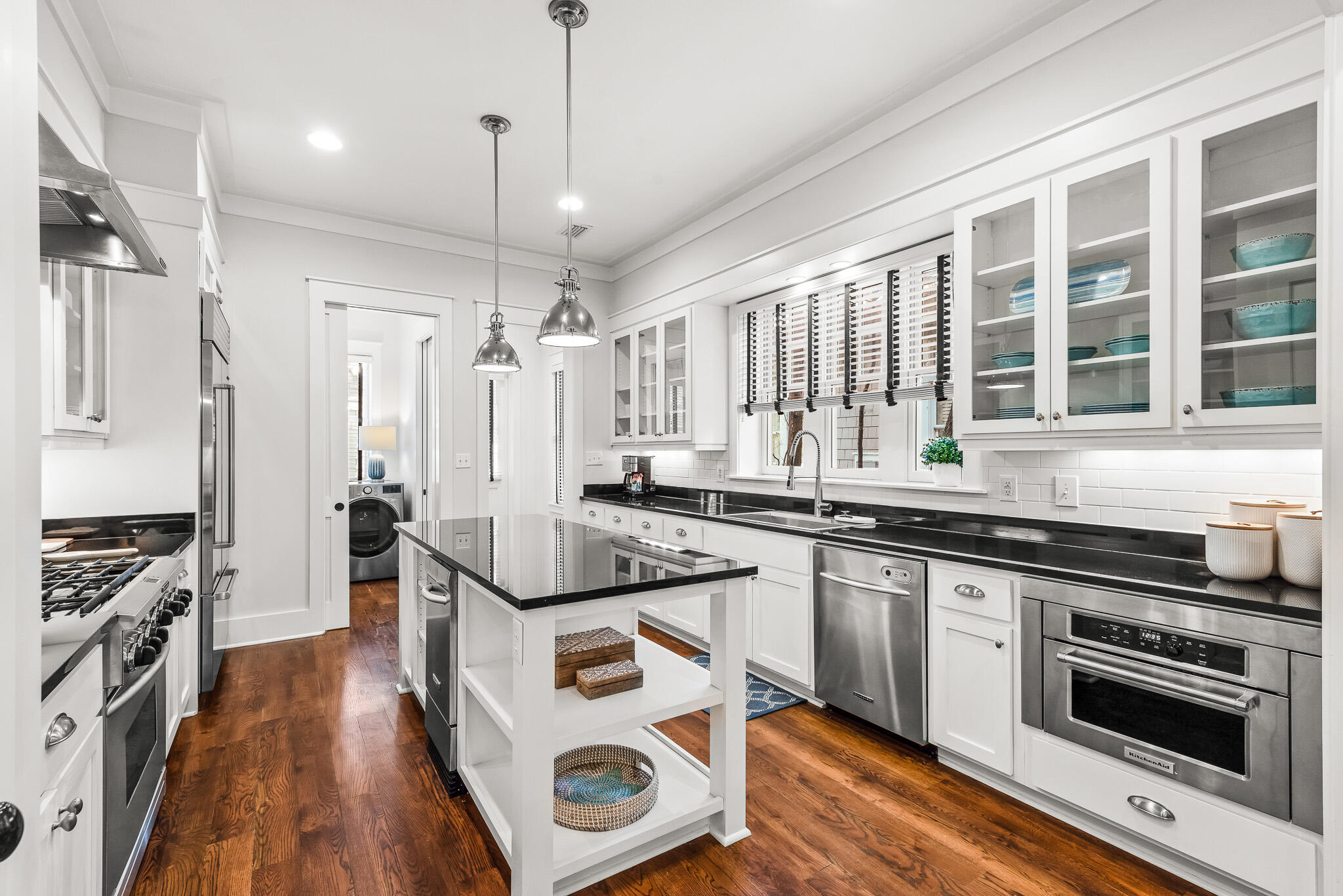 30 North Shingle Lane Watersound, FL 32461 - Photo 6 of 45 a kitchen with stainless steel appliances granite countertop a stove and cabinets