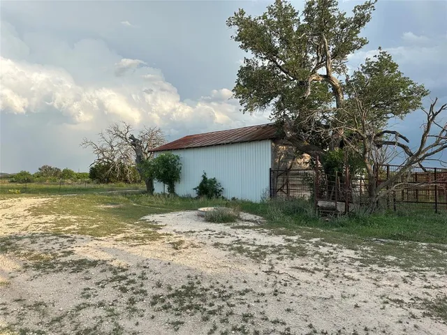 a view of backyard with green space