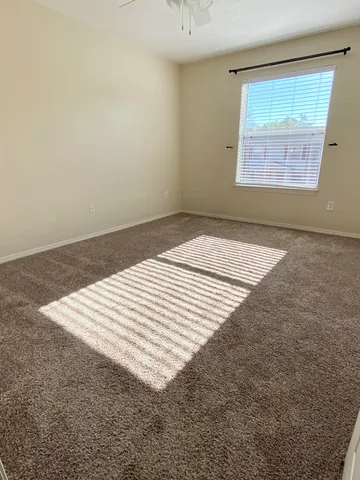 an empty room with a bed