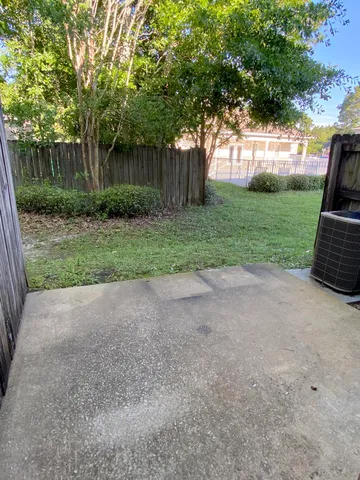 a view of backyard with green space