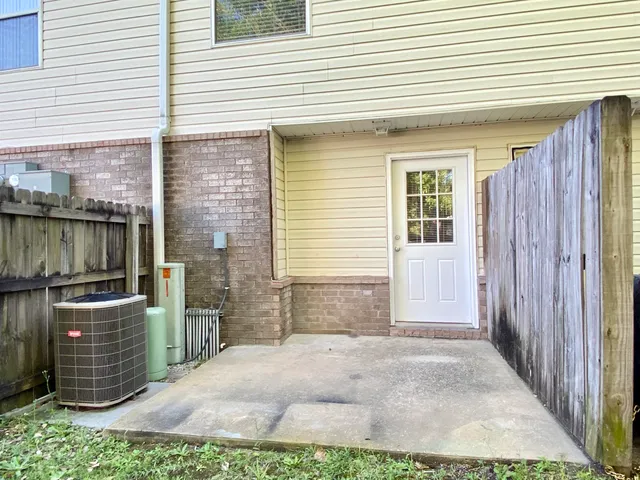 a view of a wooden door of the house