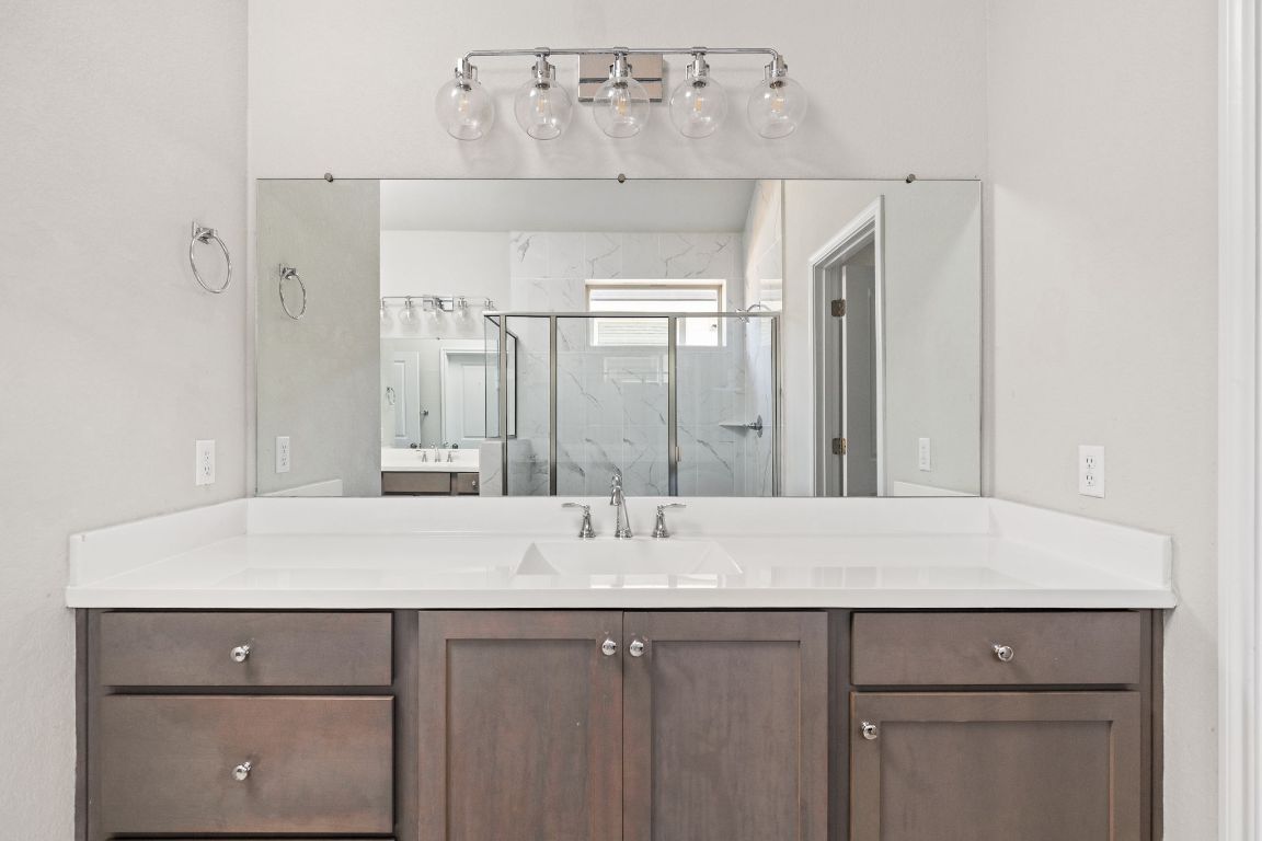 8408 Orizzonte Street Austin, TX 78744 - Photo 17 of 31 a sink with a mirror