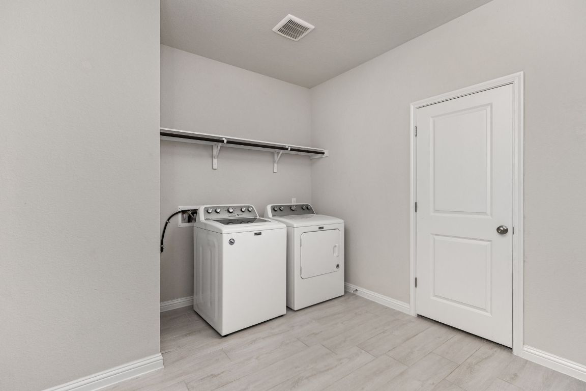 8408 Orizzonte Street Austin, TX 78744 - Photo 20 of 31 a utility room with dryer and washer